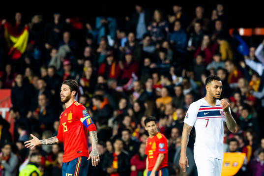 Sergio Ramos of Spain and Joshua King of Norway