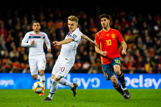 Martin Ødegaard of Norway and Marco Asensio of Spain