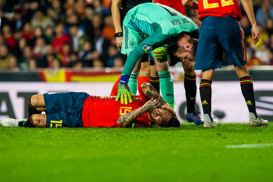 Sergio Ramos of Spain lies down with an injury