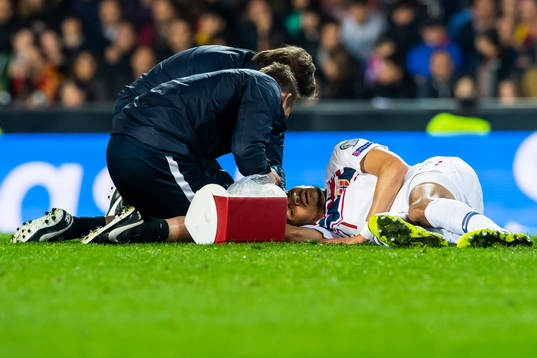 Bjørn Maars Johnsen of Norway lies down with an injury