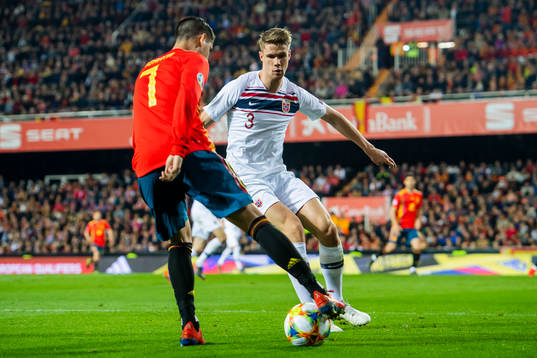 Alvaro Morata of Spain and Kristoffer Ajer of Norway