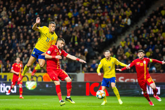 Robin Quaison of Sweden and Dragos Grigore of Romania
