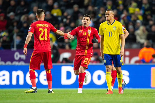 Claudiu Keseru of Romania celebrates scoring 1-2, while