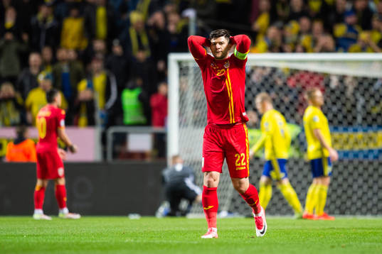 Cristian Sapunaru of Romania looks dejected