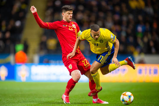 Cristian Sapunaru of Romania and Robin Quaison of Sweden