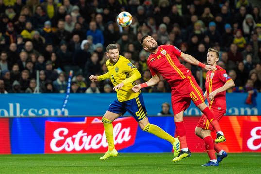 Marcus Berg of Sweden and Dragos Grigore of Romania
