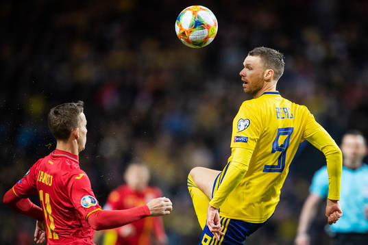 Nicusor Bancu of Romania and Marcus Berg of Sweden
