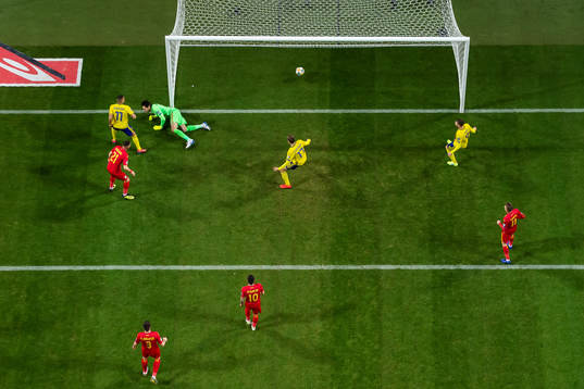 Robin Quaison (#11) of Sweden scores 1-0 behind goalkeeper