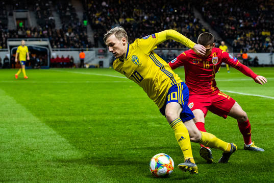 Emil Forsberg of Sweden and Razvan Marin of Romania