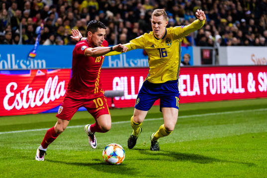 Nicolae Stanciu of Romania and Emil Krafth of Sweden