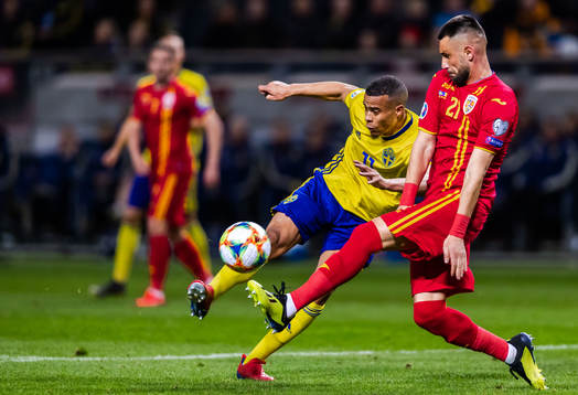 Robin Quaison of Sweden and Dragos Grigore of Romania