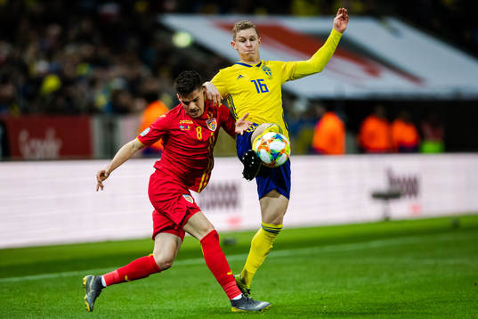 Ianis Hagi of Romania and Emil Krafth of Sweden