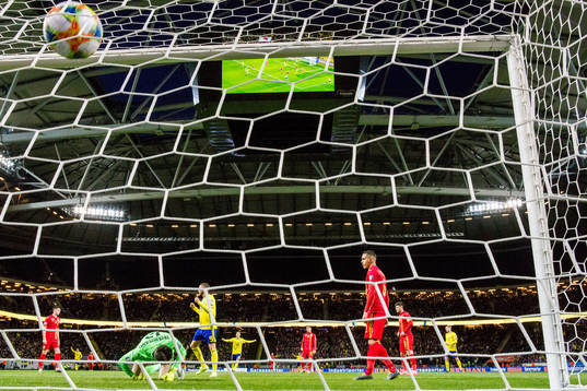 Players of Romania looks dejected