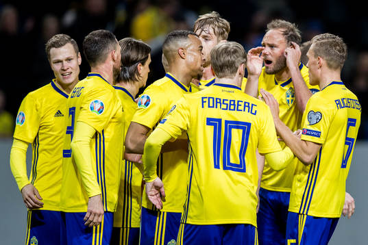 Andreas Granqvist of Sweden talks to his teammates