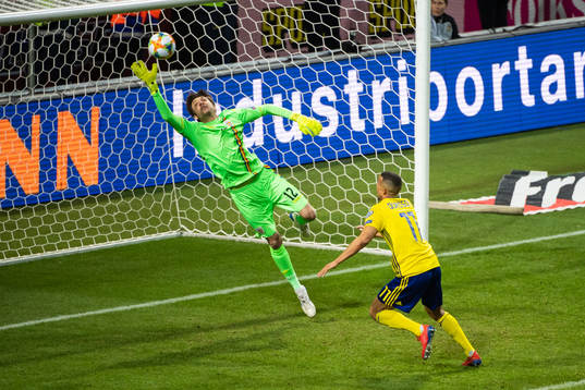 Goalkeeper Ciprian Tatarusanu of Romania with a save in
