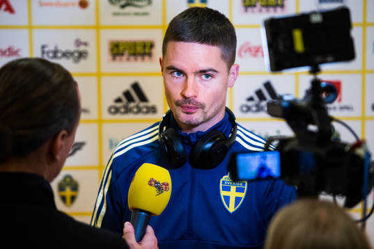 Mikael Lustig of Sweden is being interviewed by the media