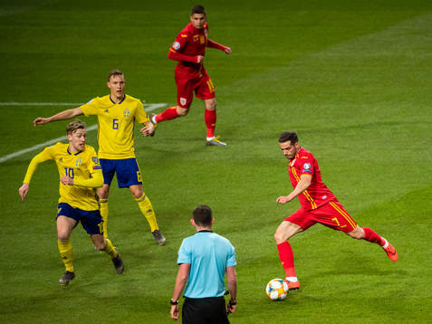 Alexandru Chipciu of Romania challenges Emil Forsberg and