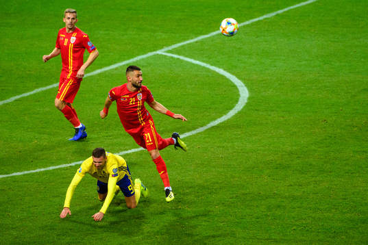 Marcus Berg of Sweden and Dragos Grigore of Romania
