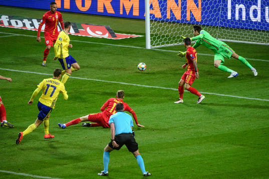 Viktor Claesson of Sweden scores the 1-0 goal behind
