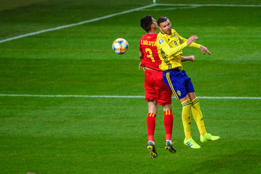 Tudor Baluta of Romania and Marcus Berg of Sweden