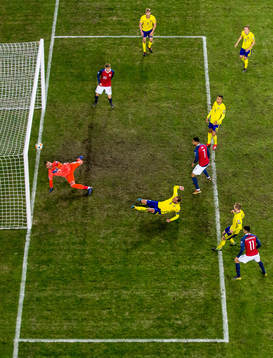 Joshua King of Norway scores 2-0 behind goalkeeper Robin