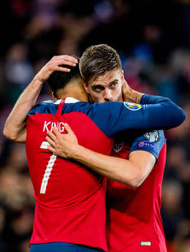 Joshua King of Norway celebrates with teammate Markus