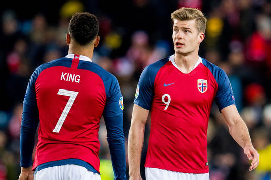 Joshua King and Alexander Sørloth of Norway look dejected