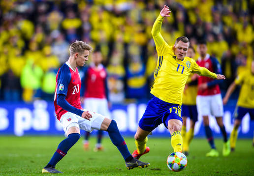 Martin Ødegaard of Norway and Viktor Claesson of Sweden