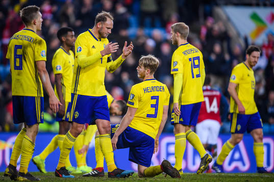 Andreas Granqvist and Filip Helander of Sweden looks