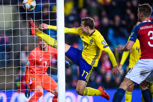 Viktor Claesson of Sweden tries to save when Ola Kamara of