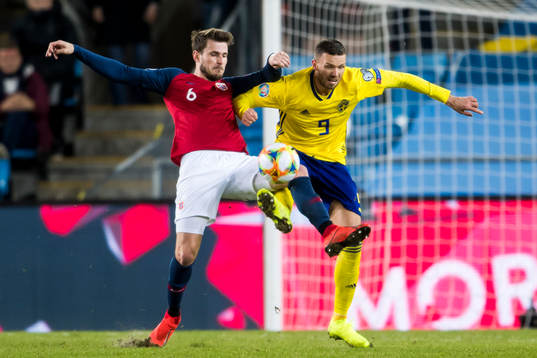 Håvard Nordtveit of Norway and Marcus Berg of Sweden