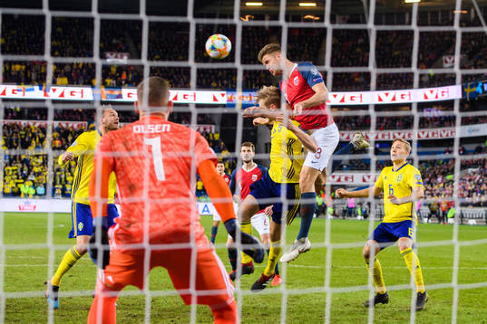 Kristoffer Ajer of Norway in action with Filip Helander of