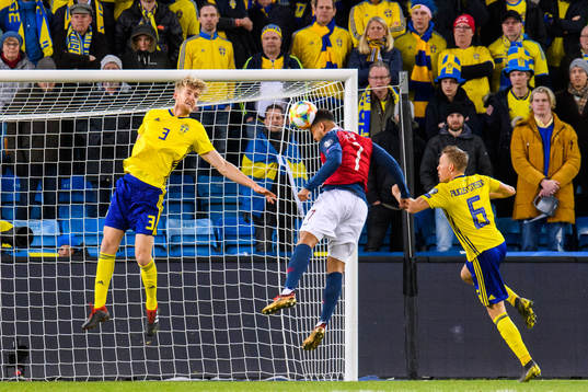 Joshua King of Norway in action with Filip Helander and