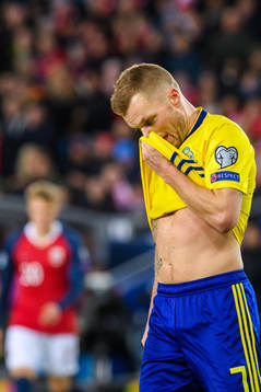 Sebastian Larsson of Sweden looks dejected