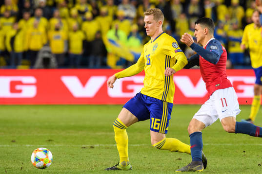 Emil Krafth of Sweden and Mohamed Elyounoussi of Norway