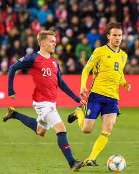 Martin Ødegaard of Norway and Albin Ekdal of Sweden