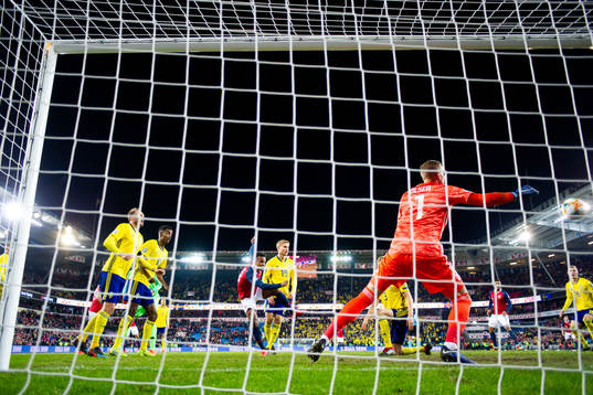 Ola Kamara of Norway scores 3-3 behind goalkeeper Robin