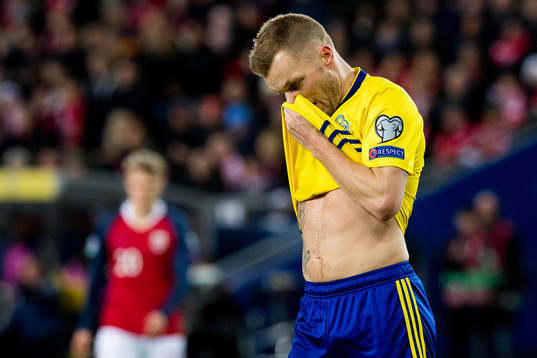 Sebastian Larsson of Sweden looks dejected
