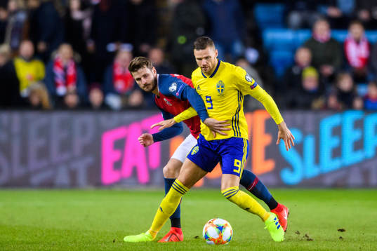 Håvard Nordtveit of Norway in action with Marcus Berg of