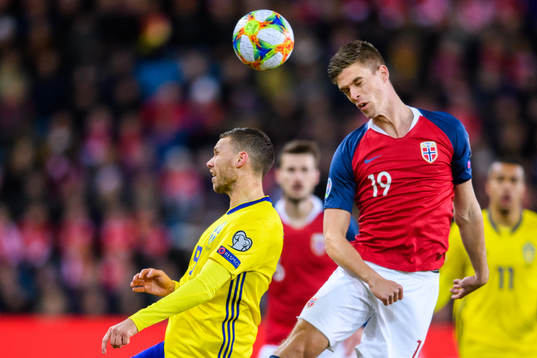 Marcus Berg of Sweden and Markus Henriksen of Norway