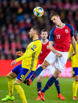 Marcus Berg of Sweden and Markus Henriksen of Norway