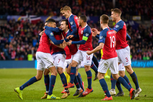 Bjørn Maars Johnsen of Norway celebrates with teammates