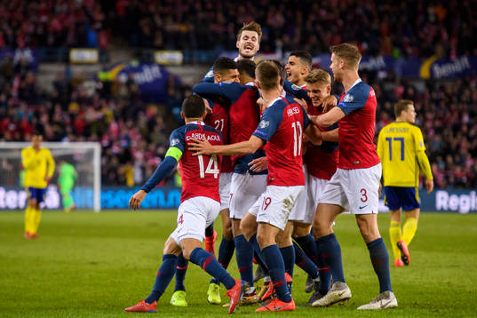 Bjørn Maars Johnsen of Norway celebrates with teammates