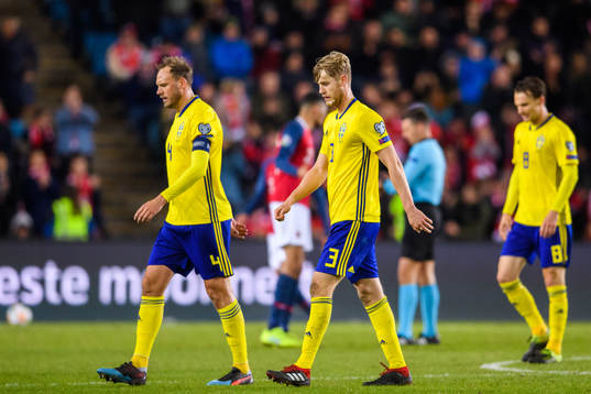 Andreas Granqvist and Filip Helander of Sweden looks