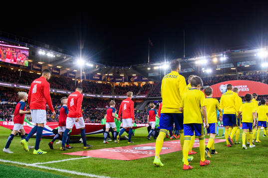 The players of Norway and Sweden enter the pitch prior to