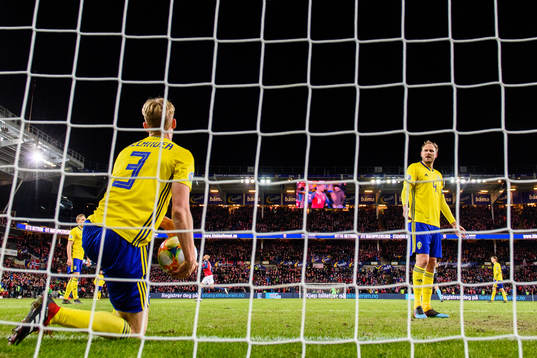 Filip Helander and Andreas Granqvist of Sweden looks