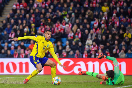 Robin Quaison of Sweden in action against goalkeeper Rune