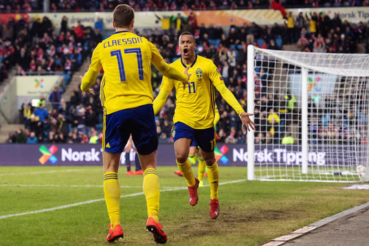 Viktor Claesson and Robin Quaison of Sweden celebrate
