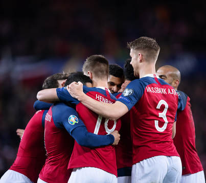 Bjørn Maars Johnsen of Norway celebrates with teammates