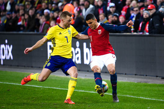 Sebastian Larsson of Sweden and Mohamed Elyounoussi of